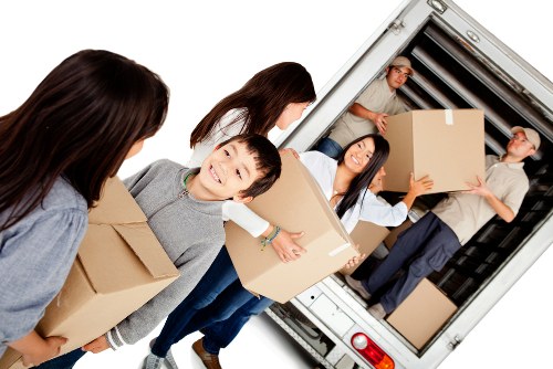 Moving staff carrying items carefully during an Osterley van service