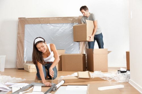 Removal van and movers preparing a house move in Osterley