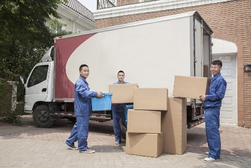 Packed boxes and moving equipment ready for a removal service in Osterley