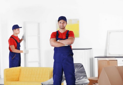 Professional movers loading furniture for a home relocation in Osterley