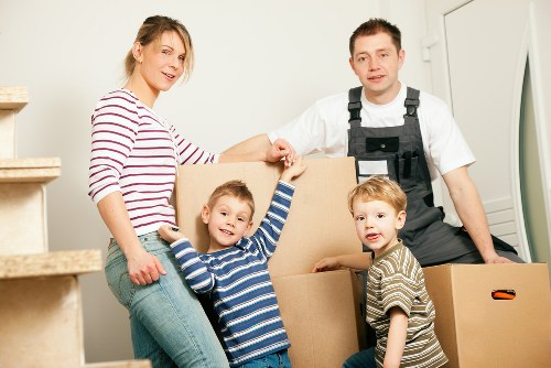 Removal van and movers handling a residential move in Osterley