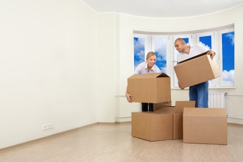 Local moving team handling household furniture in Osterley