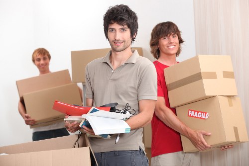 Professional movers unloading belongings at an Osterley property