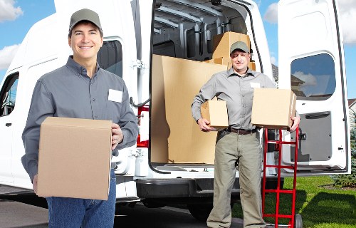 Team organising desks and boxes during an office move